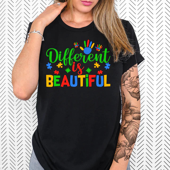 a woman wearing a black shirt that says different is beautiful